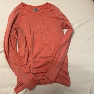 Coral long sleeve size medium Athleta top. Athletic material and has thumb holes